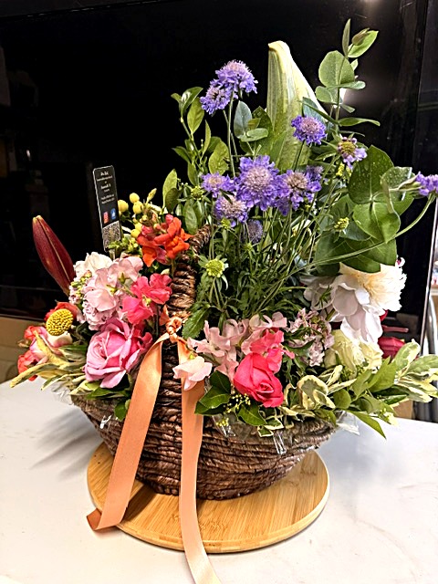 Basket arrangement with purple scabiosa