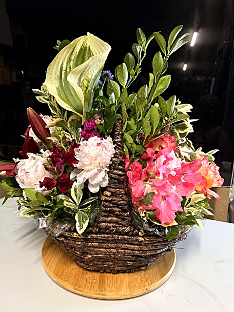 Basket with hosta and sweet peas